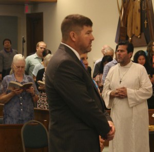 David Clegg makes a Profession of Faith in the Catholic Church at the Easter Vigil.